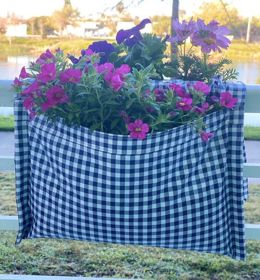 Blue gingham railing planter for flowers, plants and herbs like a saddle bag and hangs from the railing of a patio, balcony, deck or terrance.